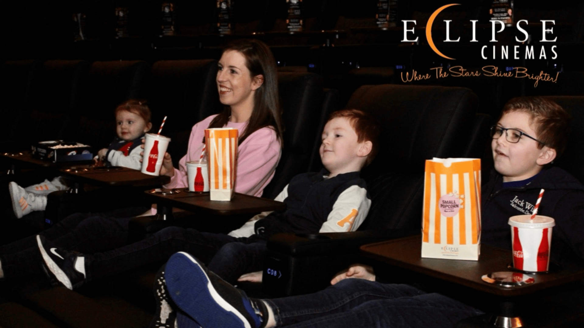 Family enjoying Eclipse Cinemas Private Screen Rental 